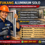 Smiling aluminum worker with orange helmet installing a sliding aluminum door in front of a modern home; company branding visible on his blue uniform and a red banner advertises services.
